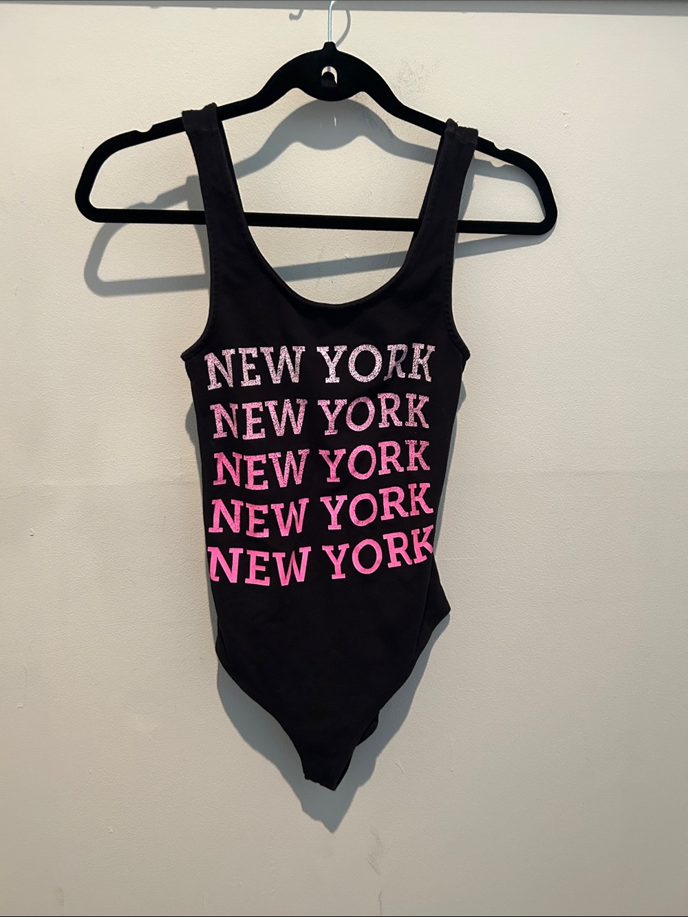 Bella Canvas Black One-Piece Bodysuit with Pink "New York" Graphic